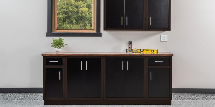 Rock Run Cabinetry Aluminum Garage Kitchen Cabinets shown in Walnut and Poly Black Peel